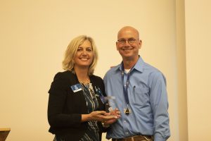 Kelly Manker receiving Community Hero award